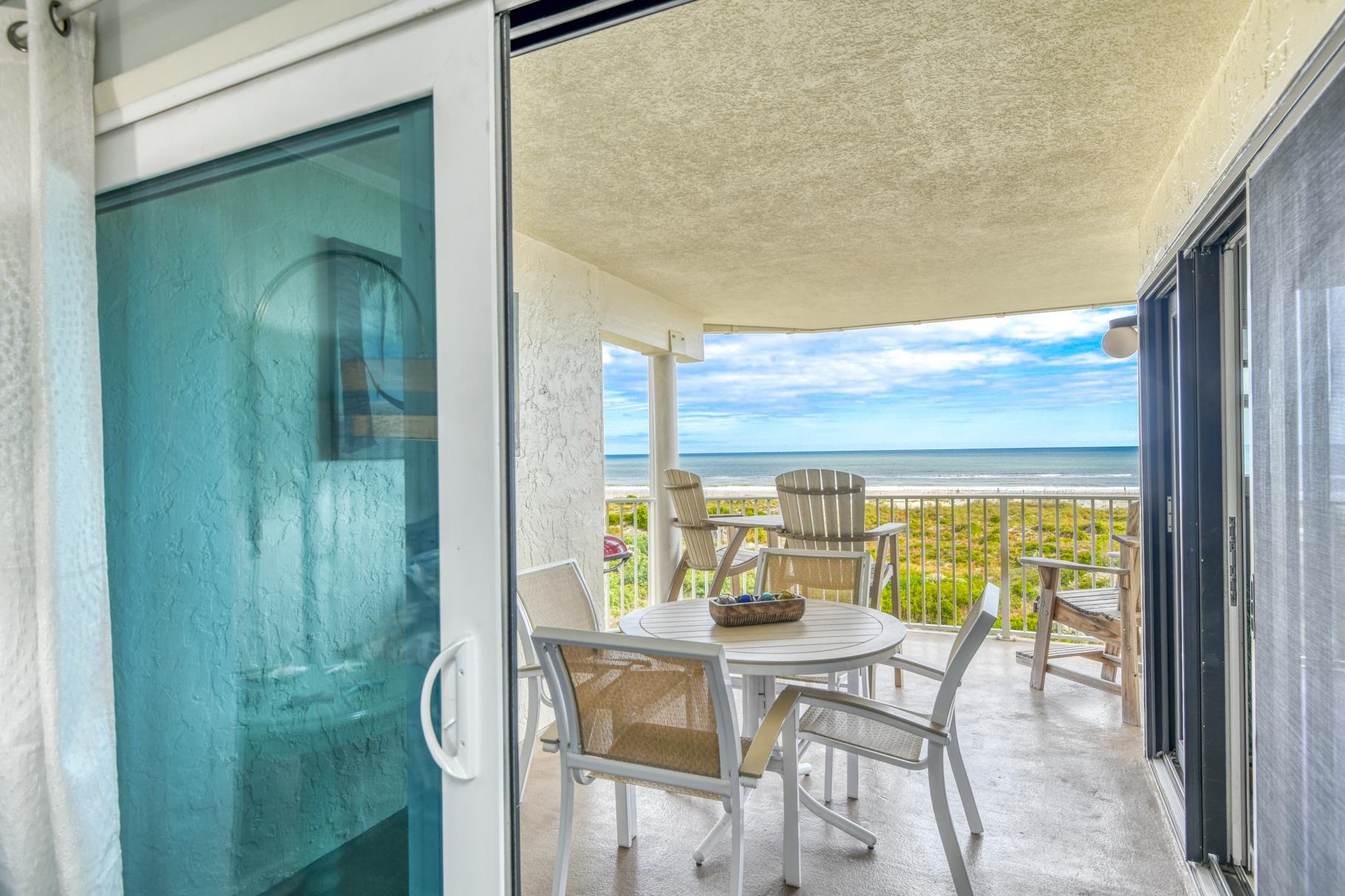 4670 A1A South, Unit 1402 St. Augustine, FL 32080 - Photo 14 of 47 a view of a dining room with furniture and a window