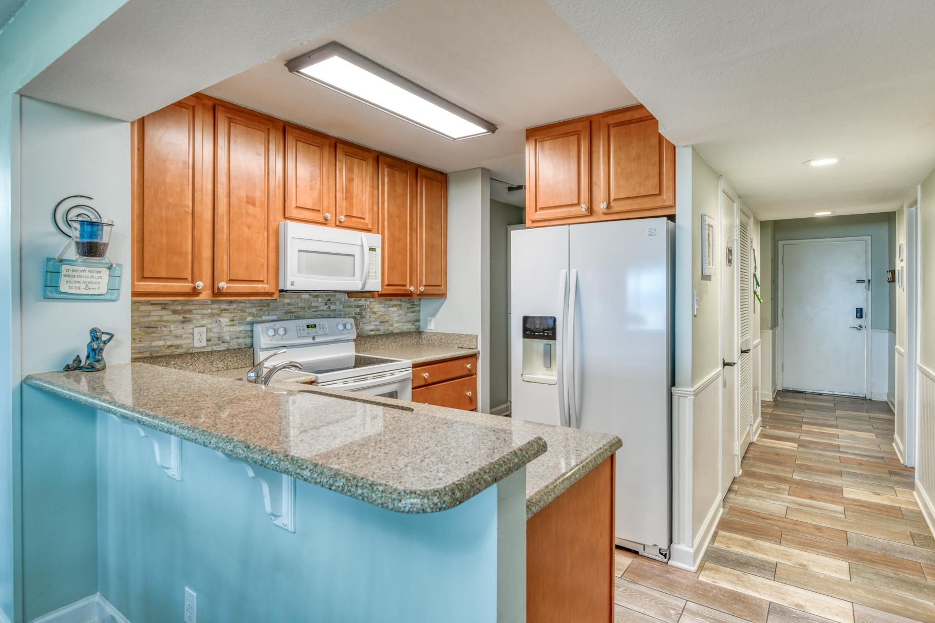 4670 A1A South, Unit 1402 St. Augustine, FL 32080 - Photo 4 of 47 a kitchen with stainless steel appliances granite countertop a refrigerator a sink dishwasher a stove and oven