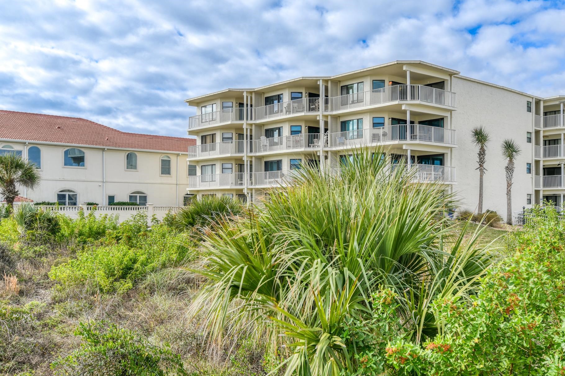 4670 A1A South, Unit 1402 St. Augustine, FL 32080 - Photo 44 of 47 a front view of a house with a garden