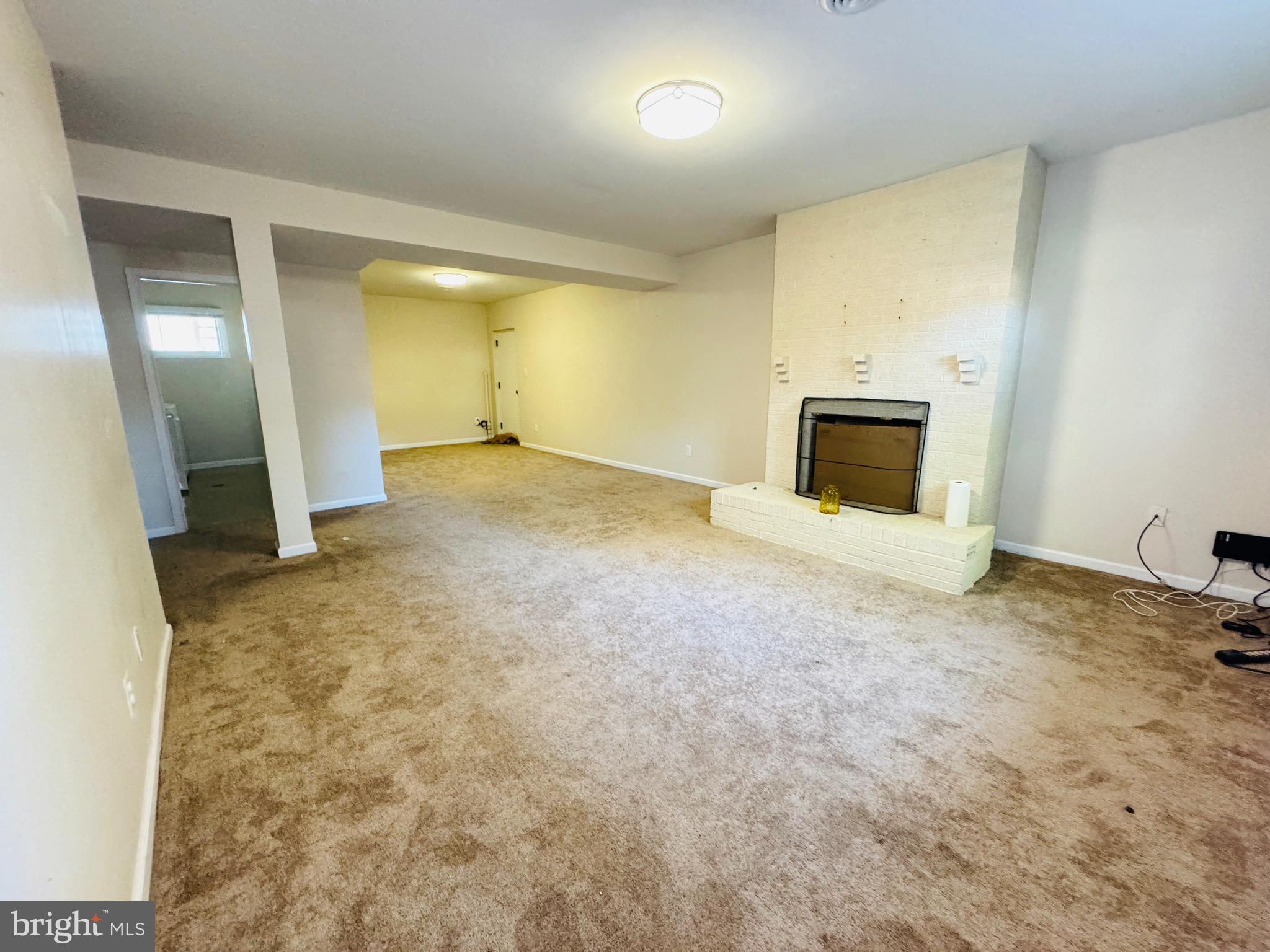 4911 Sargent Road Northeast Washington, DC 20017 - Photo 16 of 29 Lower Den with Fireplace