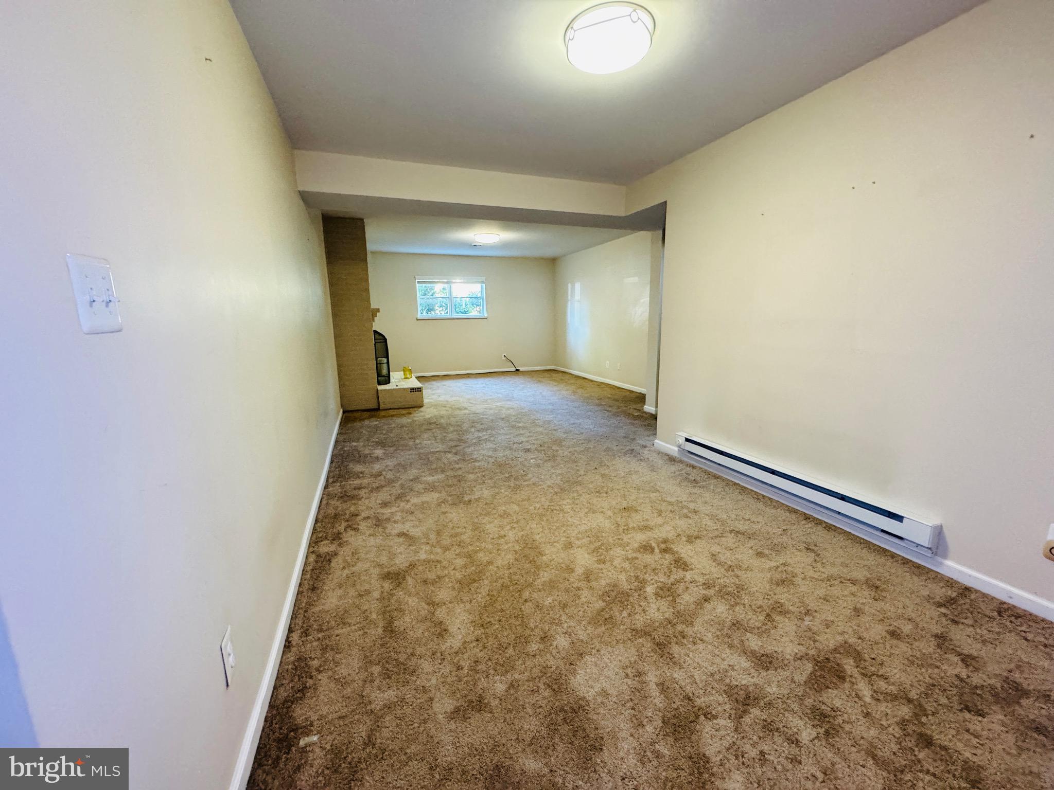 4911 Sargent Road Northeast Washington, DC 20017 - Photo 17 of 29 Lower Den with Fireplace