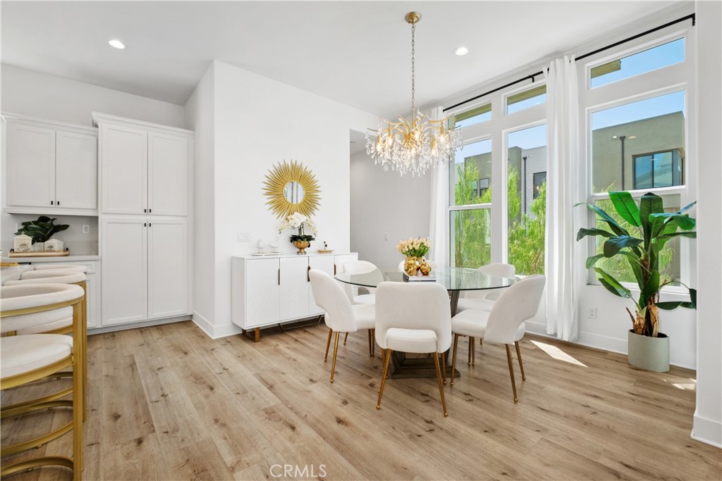 154 Keeper Irvine, CA 92618 - Photo 12 of 42 a view of a dining room with furniture window and wooden floor