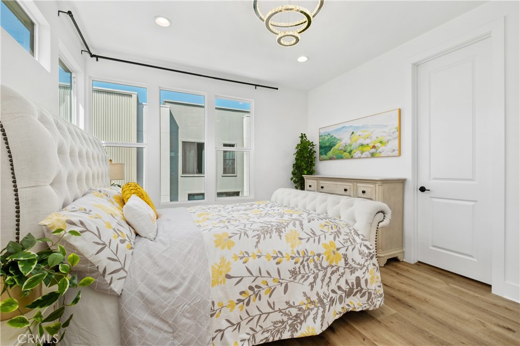 154 Keeper Irvine, CA 92618 - Photo 17 of 42 a bed sitting in a bedroom next to a window