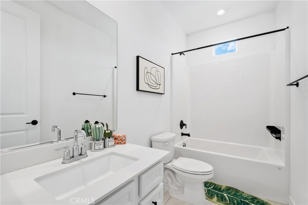 154 Keeper Irvine, CA 92618 - Photo 22 of 42 a bathroom with a sink a toilet and shower