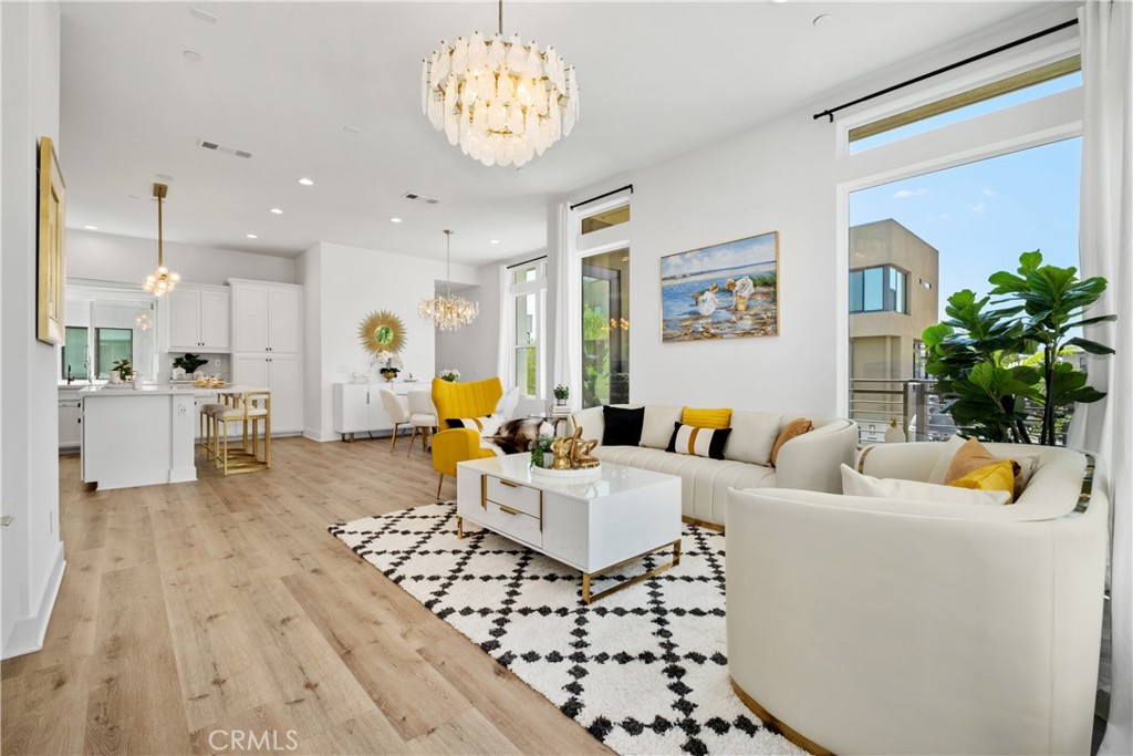 154 Keeper Irvine, CA 92618 - Photo 4 of 42 a living room with furniture and a chandelier