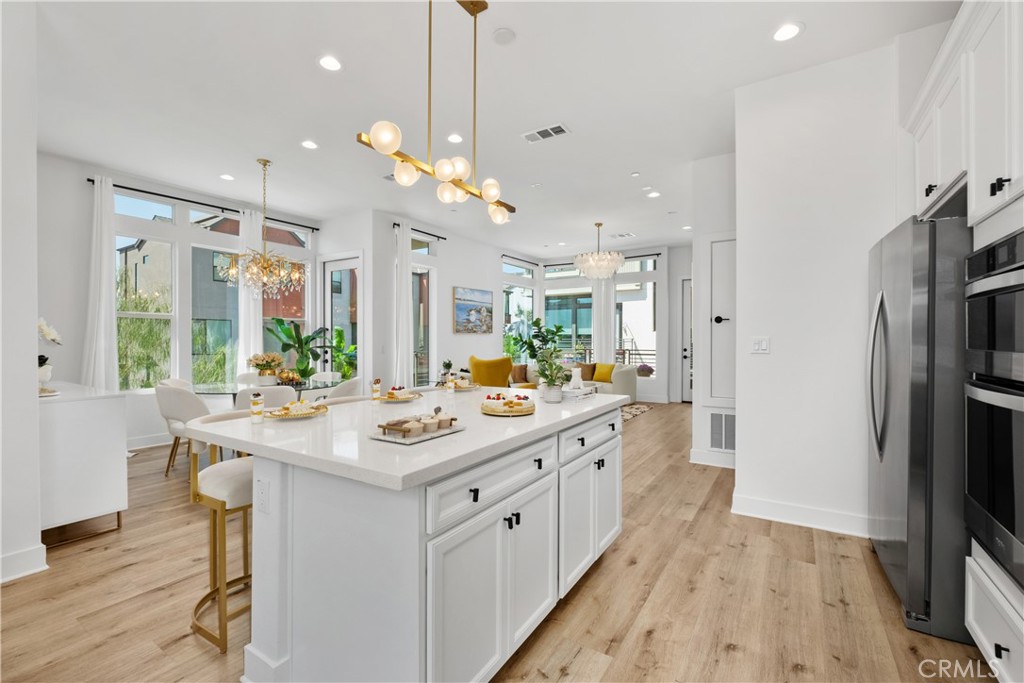 154 Keeper Irvine, CA 92618 - Photo 10 of 42 a kitchen with a sink stove and refrigerator