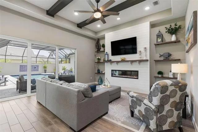 a view of a patio with table and chairs under an umbrella