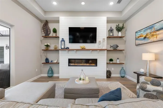 a bedroom with a bed table and a window