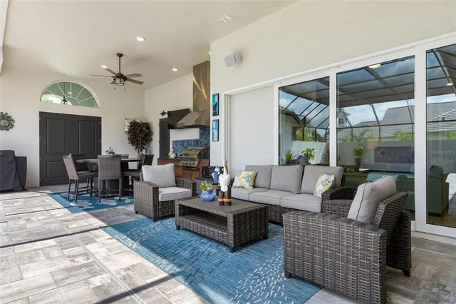 a white bath tub sitting in a bathroom next to a window