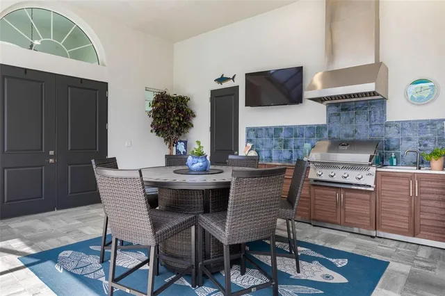 a bathroom with a granite countertop bathtub next to a window