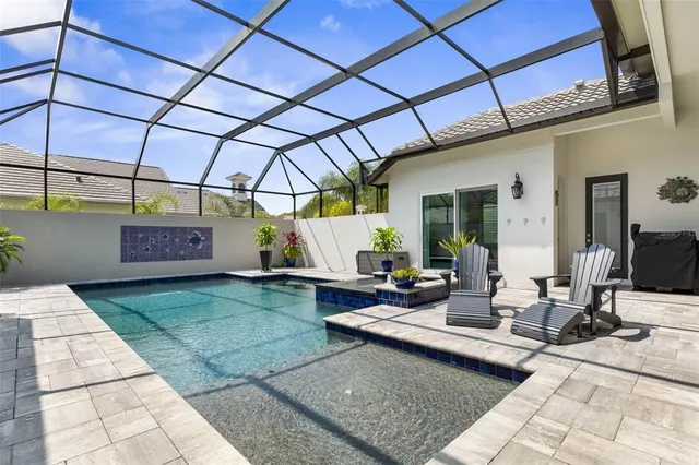 a living room with furniture and large windows