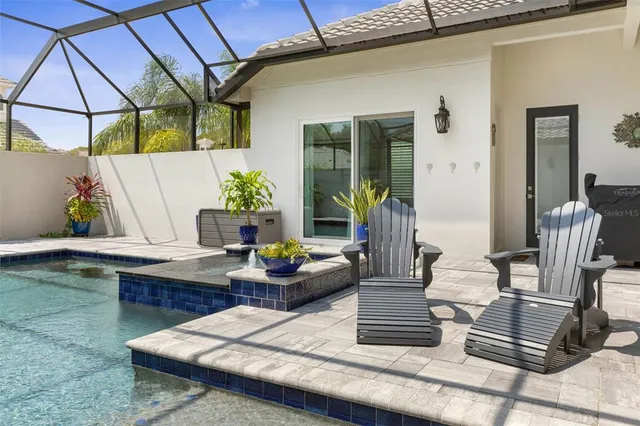 a living room with furniture and a dining table