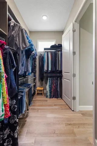 an aerial view of residential houses with outdoor space and street view