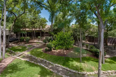 a backyard of a house with lots of green space