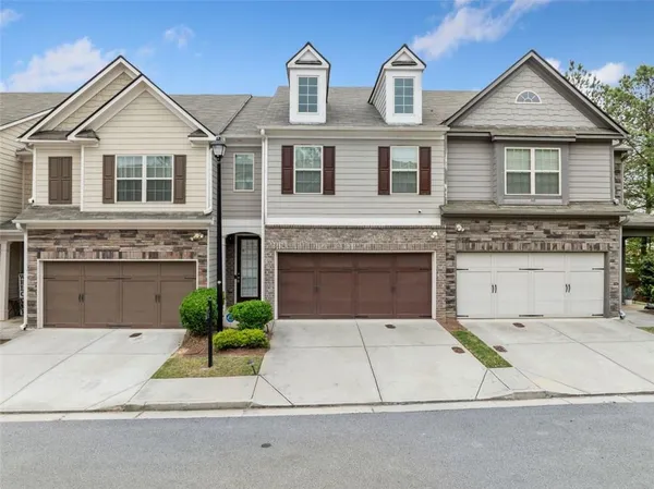 a front view of a house with yard