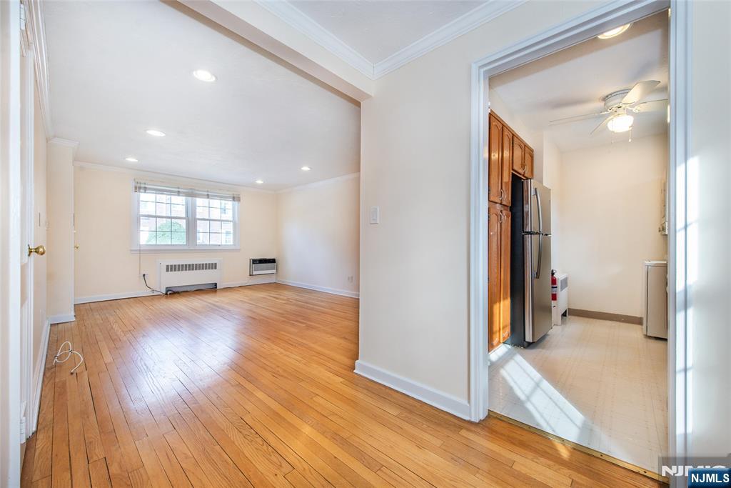 445 Morris Avenue, Unit 7C Springfield, NJ 07081 - Photo 6 of 16 a view of empty room and wooden floor