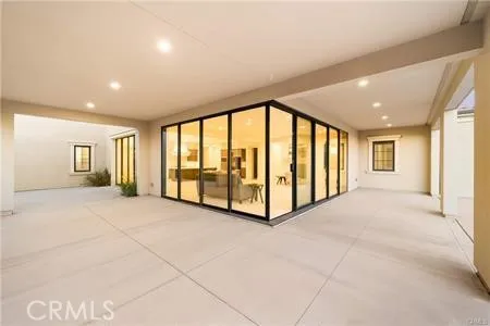 a view of an empty room with a balcony
