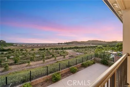 a view of city and mountain from a balcony