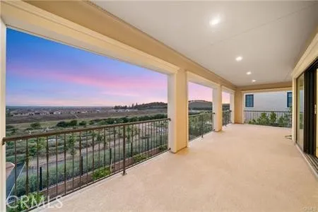 a view of balcony with city and ocean view
