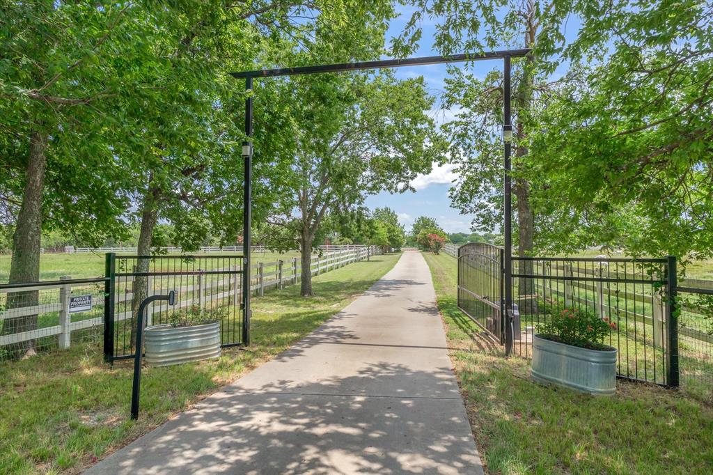 2141 Poetry Road Royse City, TX 75189 - Photo 33 of 38 Gated entrance with concrete drive ton home.