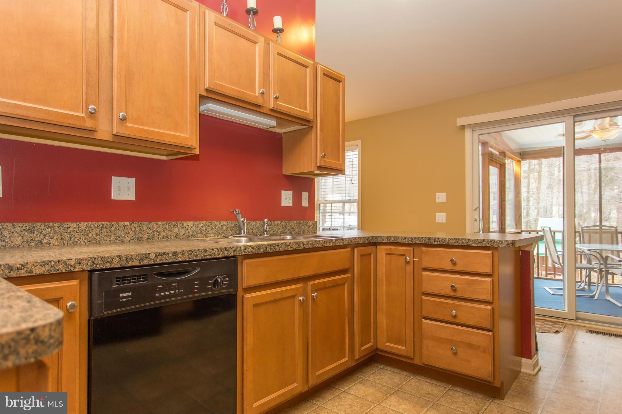 207 Battlefield Road Locust Grove, VA 22508 - Photo 16 of 30 Kitchen exposes the stunning screened in sun room