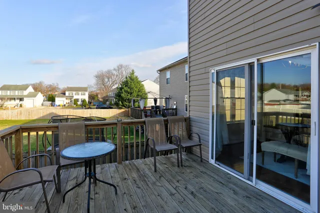 a view of a chairs and table in patio with a dining space