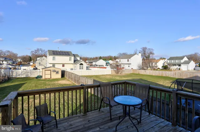 a view of a balcony with a table and chairs