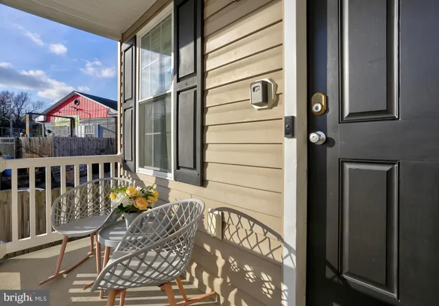 a view of balcony with furniture