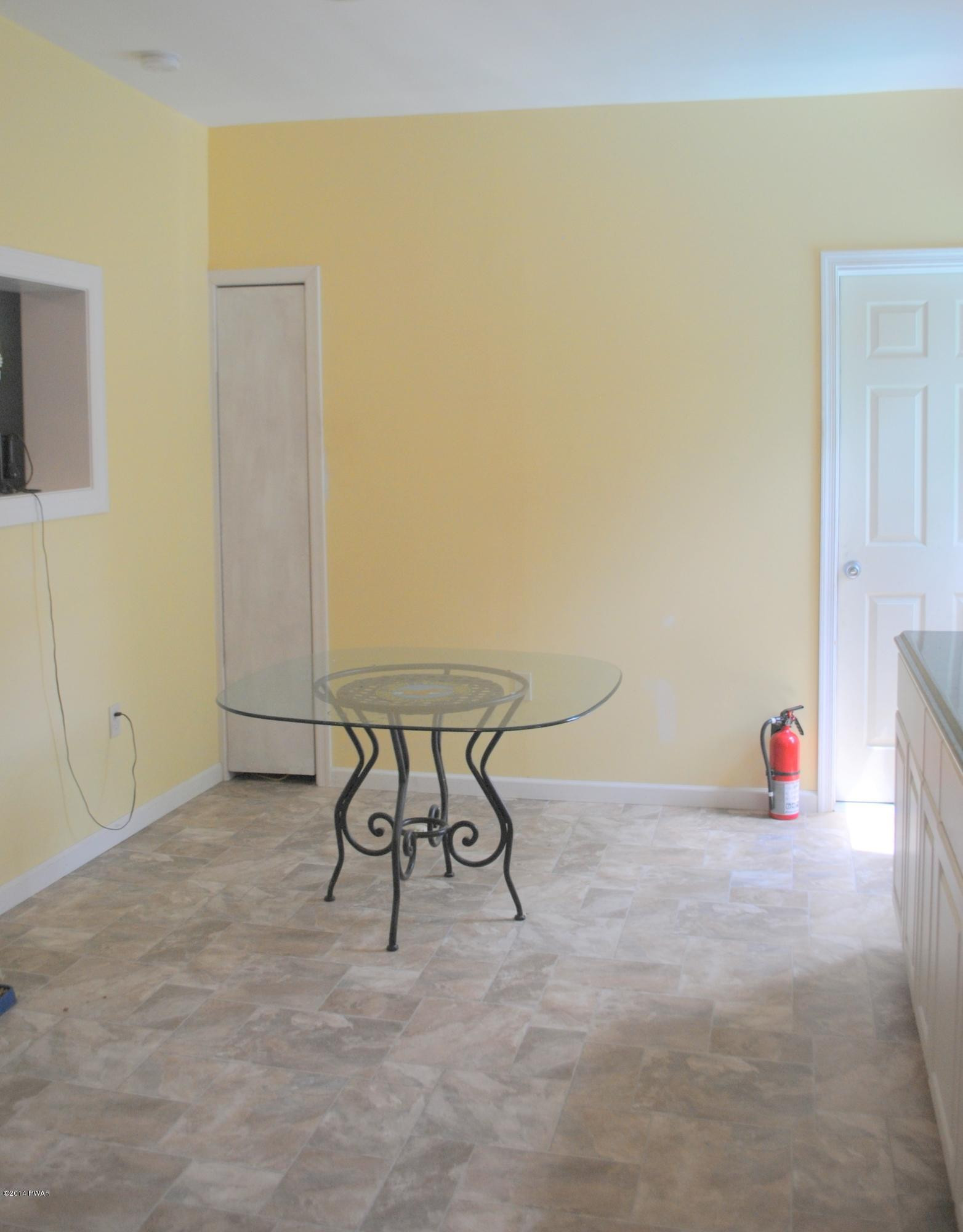 600 Neville Road Moscow, PA 18444 - Photo 22 of 35 a view of a room with table and chair