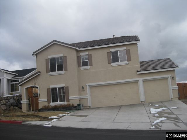 5020 Hitch Road Reno, NV 89506 - Photo 3 of 4 a front view of a house with yard