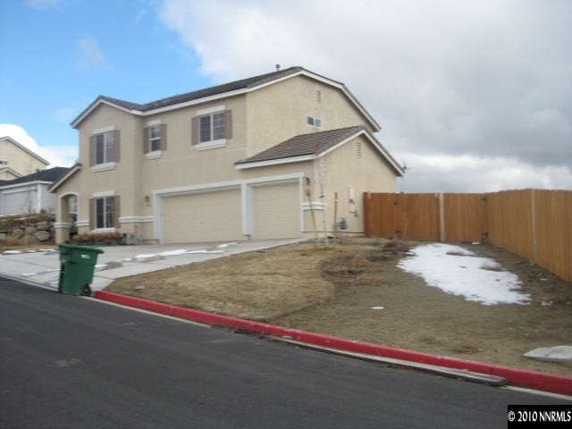 5020 Hitch Road Reno, NV 89506 - Photo 4 of 4 a front view of a house with a garage