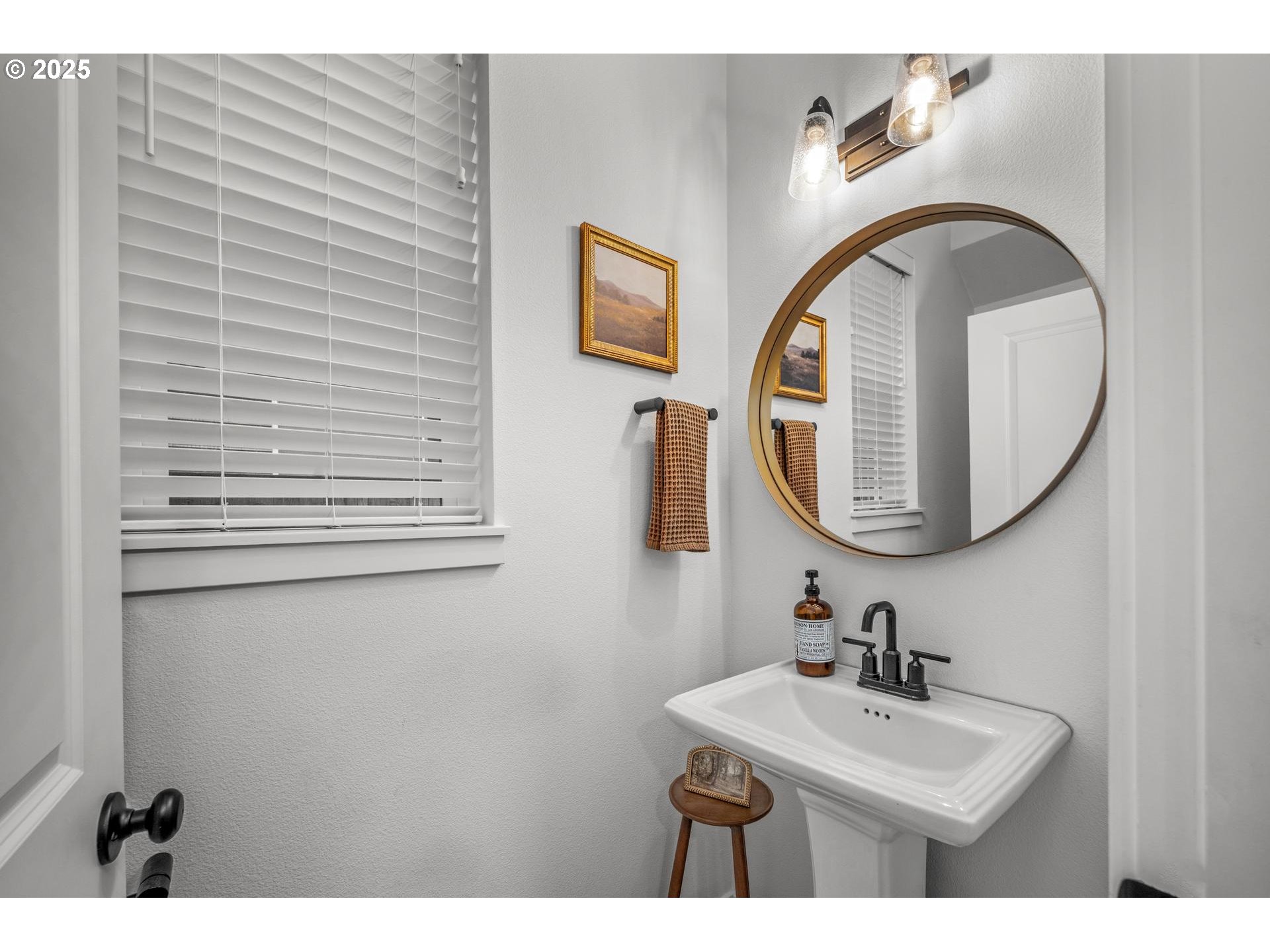 2427 South Linden Street Cornelius, OR 97113 - Photo 17 of 37 a bathroom with a sink and a mirror