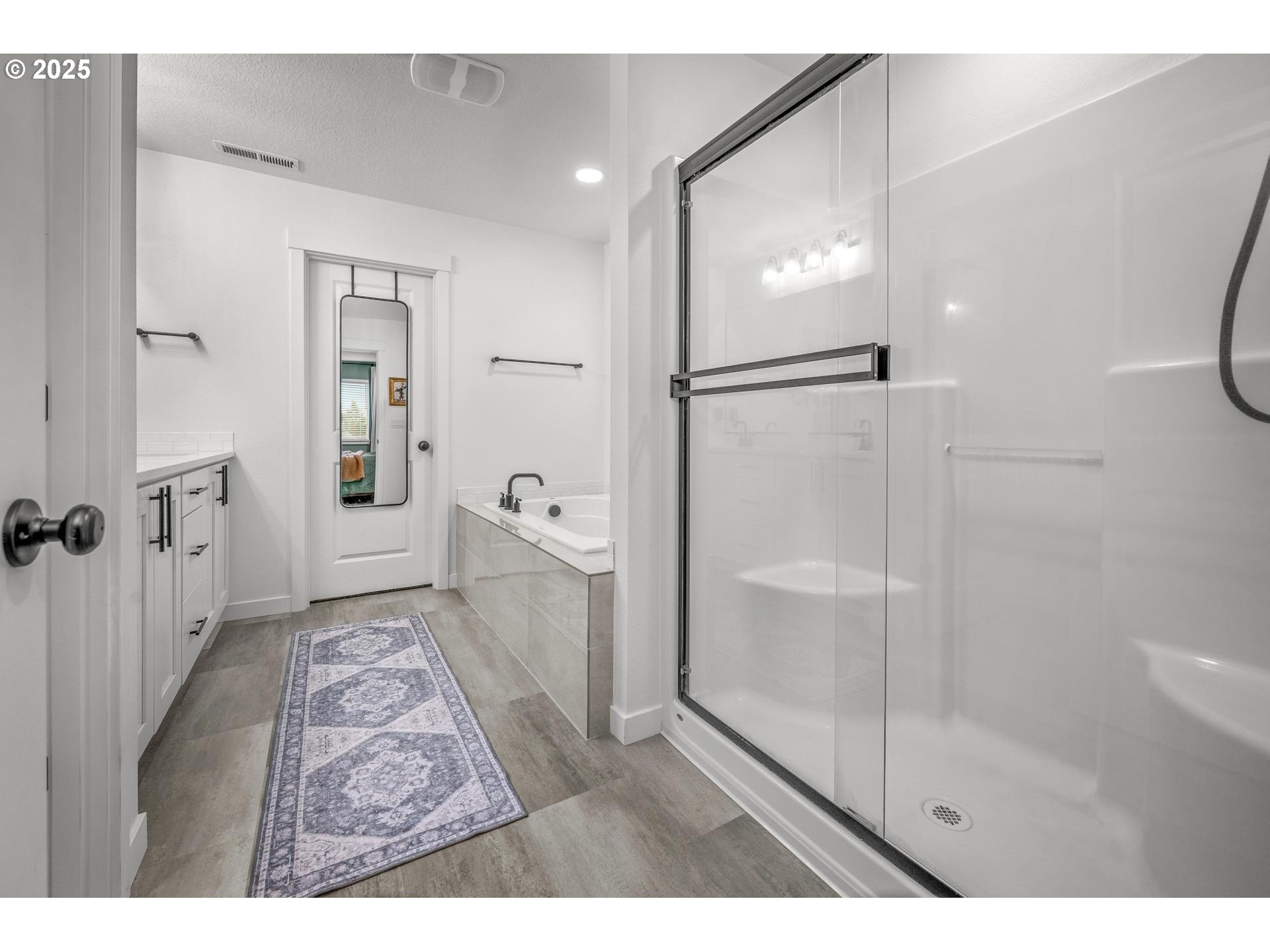 2427 South Linden Street Cornelius, OR 97113 - Photo 24 of 37 a bathroom with a shower and a glass door