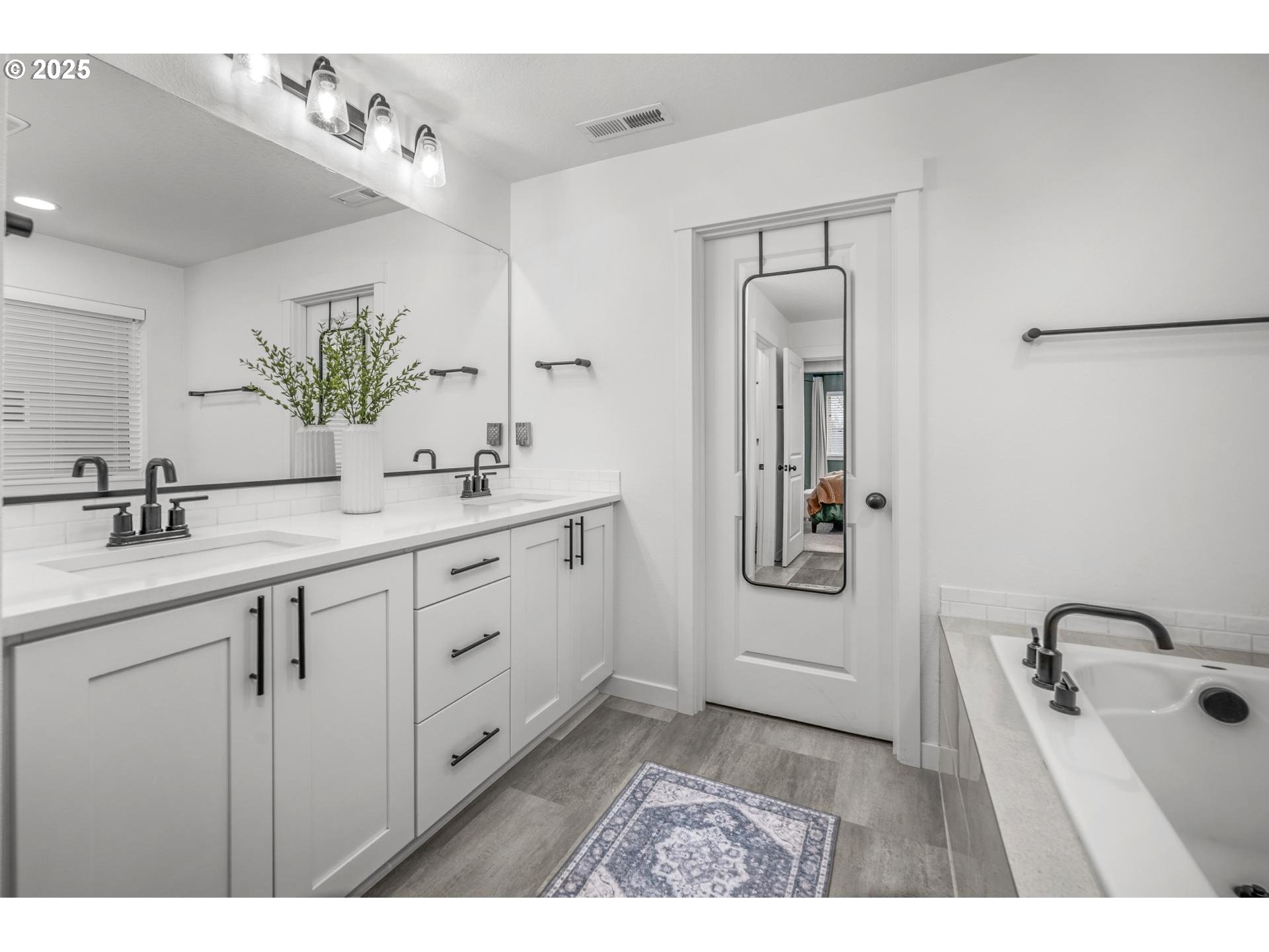 2427 South Linden Street Cornelius, OR 97113 - Photo 25 of 37 a bathroom with a double vanity sink mirror and