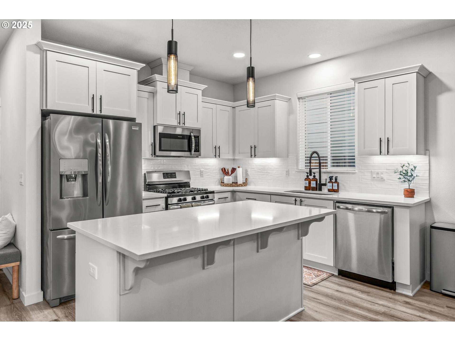 2427 South Linden Street Cornelius, OR 97113 - Photo 3 of 37 a kitchen with stainless steel appliances a sink stove and refrigerator