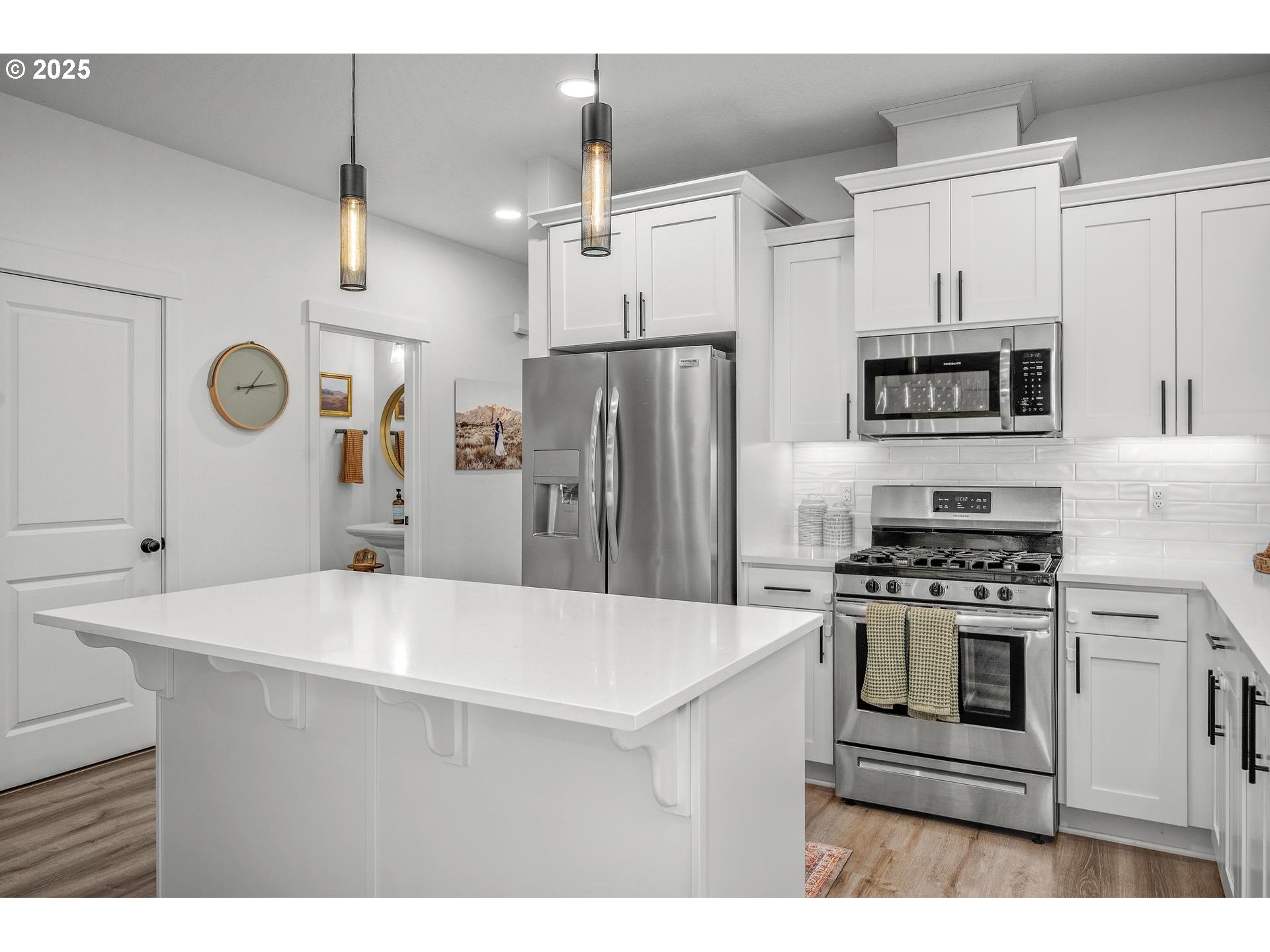 2427 South Linden Street Cornelius, OR 97113 - Photo 5 of 37 a kitchen with a stove a sink and a refrigerator