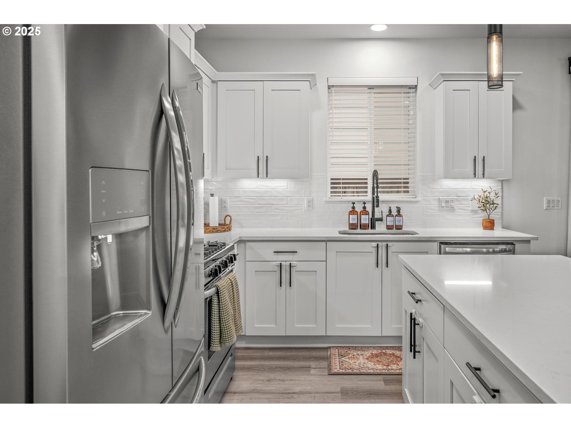 2427 South Linden Street Cornelius, OR 97113 - Photo 6 of 37 a kitchen with a refrigerator sink and cabinets