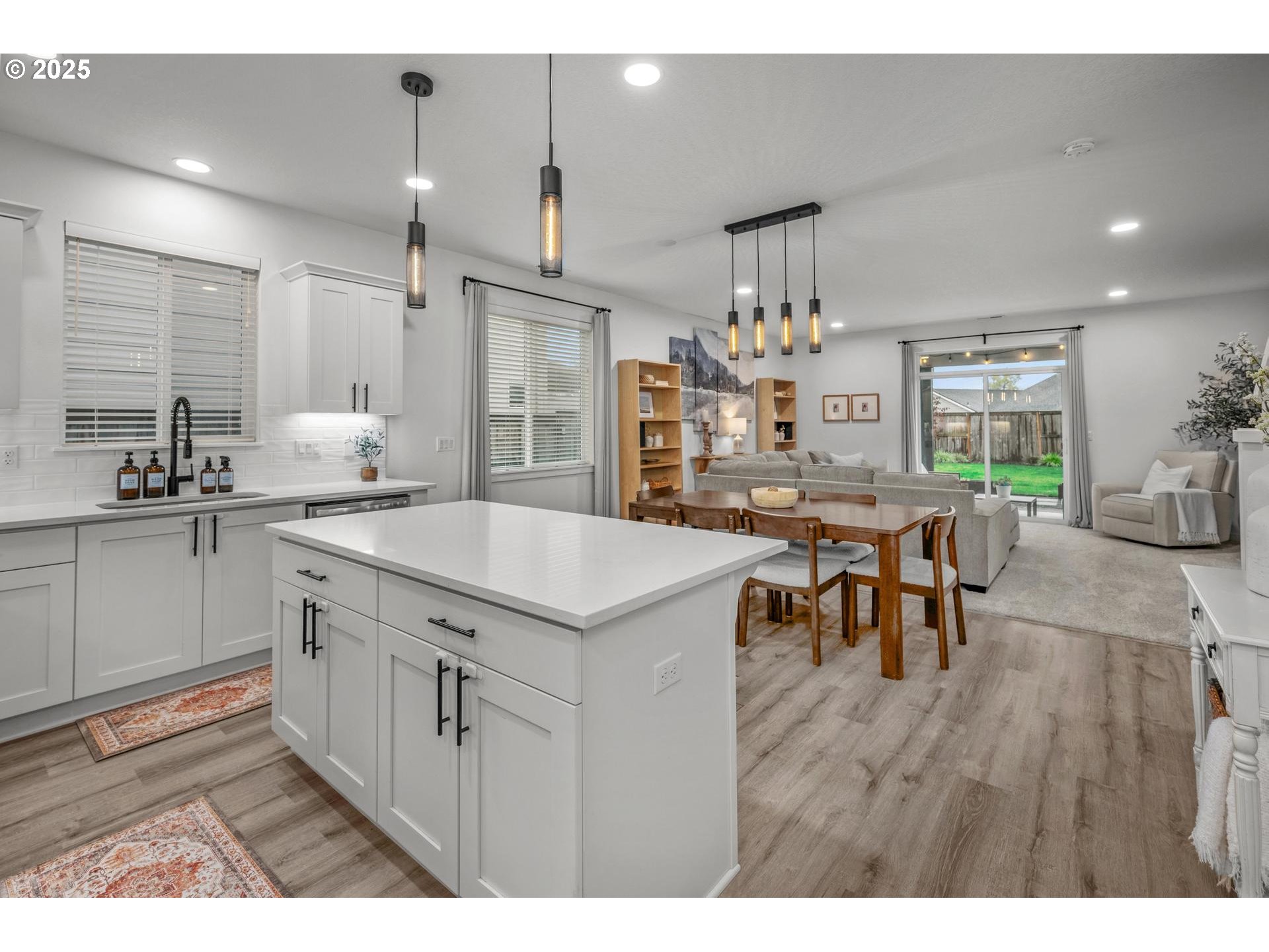 2427 South Linden Street Cornelius, OR 97113 - Photo 9 of 37 a kitchen with kitchen island granite countertop a sink and cabinets