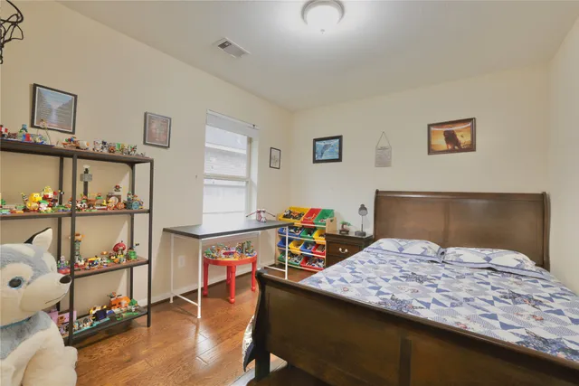 a view of a workspace with furniture and a bookshelf