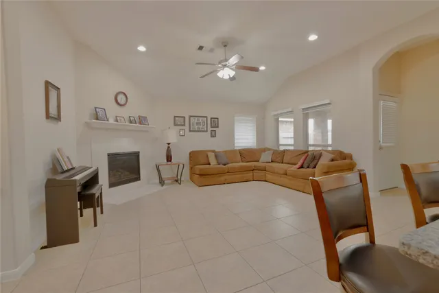 a kitchen with stainless steel appliances granite countertop a sink dishwasher stove refrigerator and cabinets