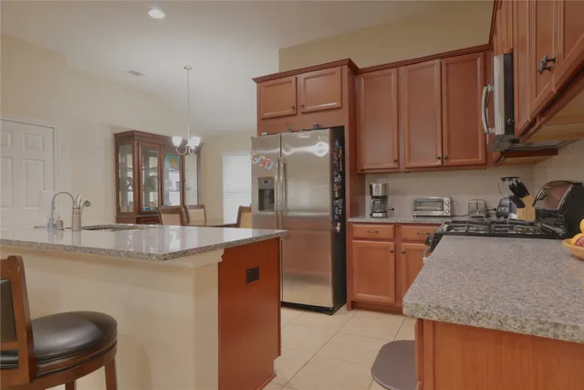 a view of a dining room with furniture and window