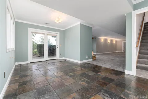 a view of a big room with windows and closet
