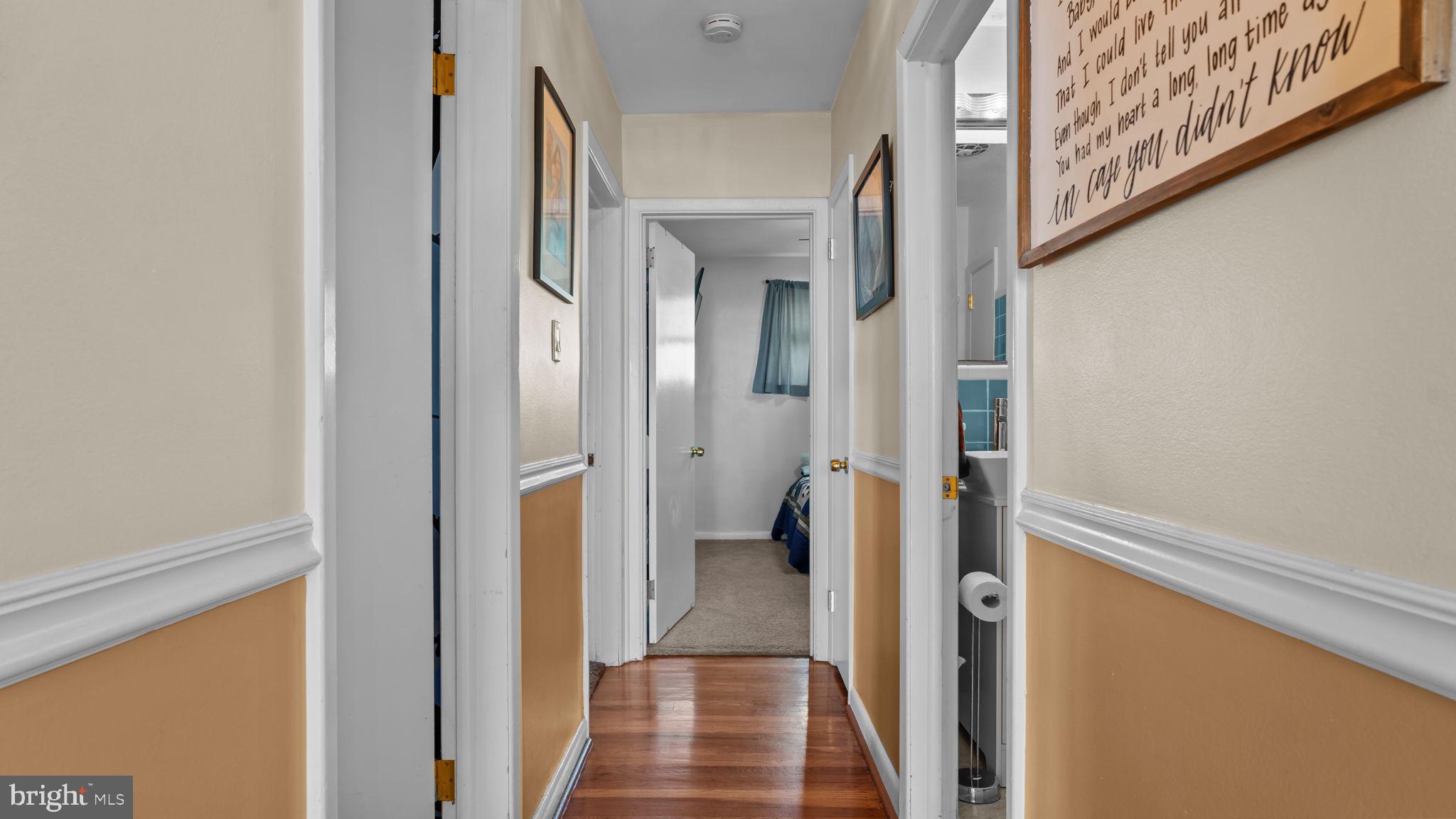 526 Palmer Road Conshohocken, PA 19428 - Photo 12 of 31 a view of a hallway with wooden floor and staircase
