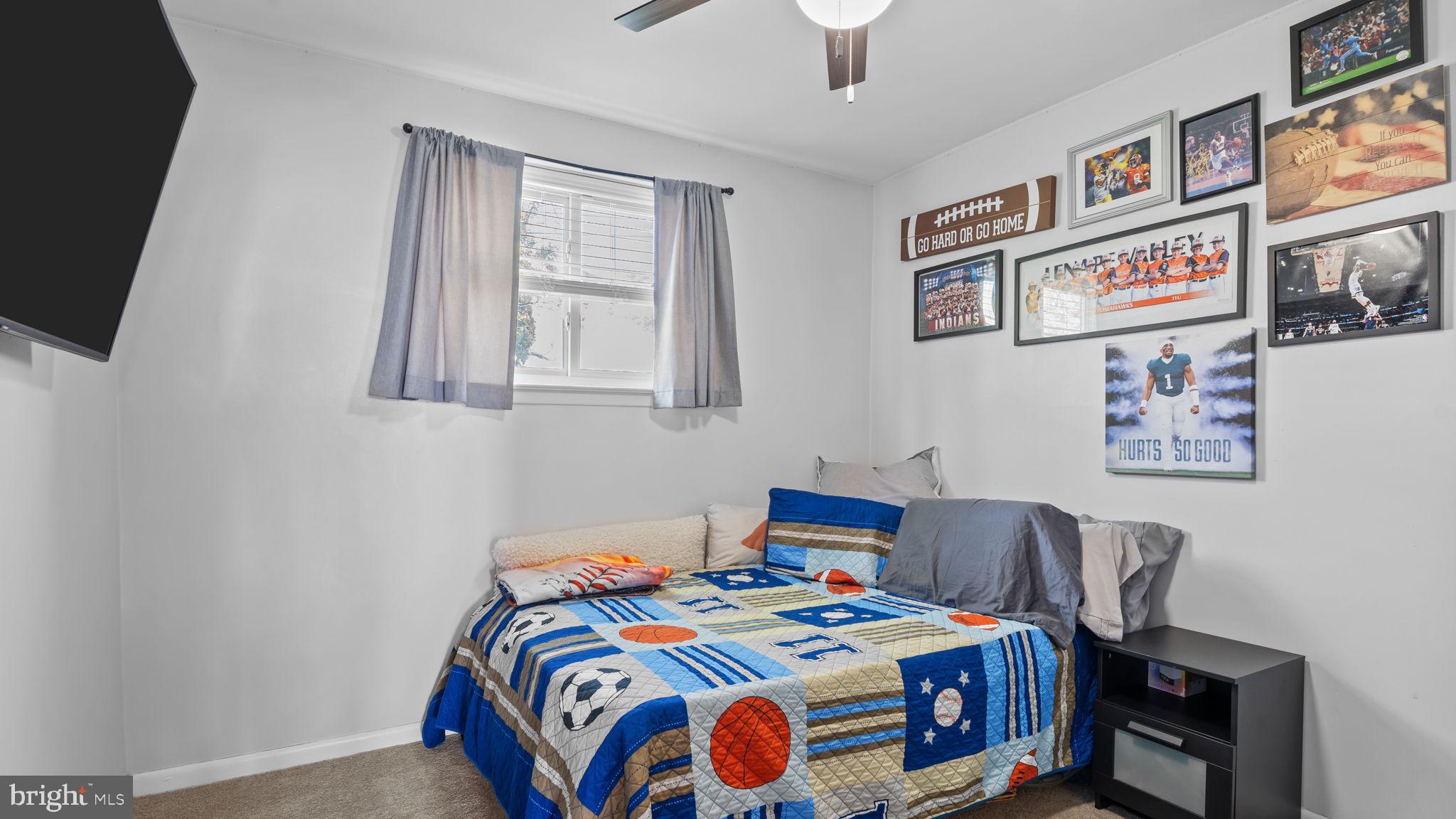 526 Palmer Road Conshohocken, PA 19428 - Photo 14 of 31 a bedroom with bed and paintings on the wall