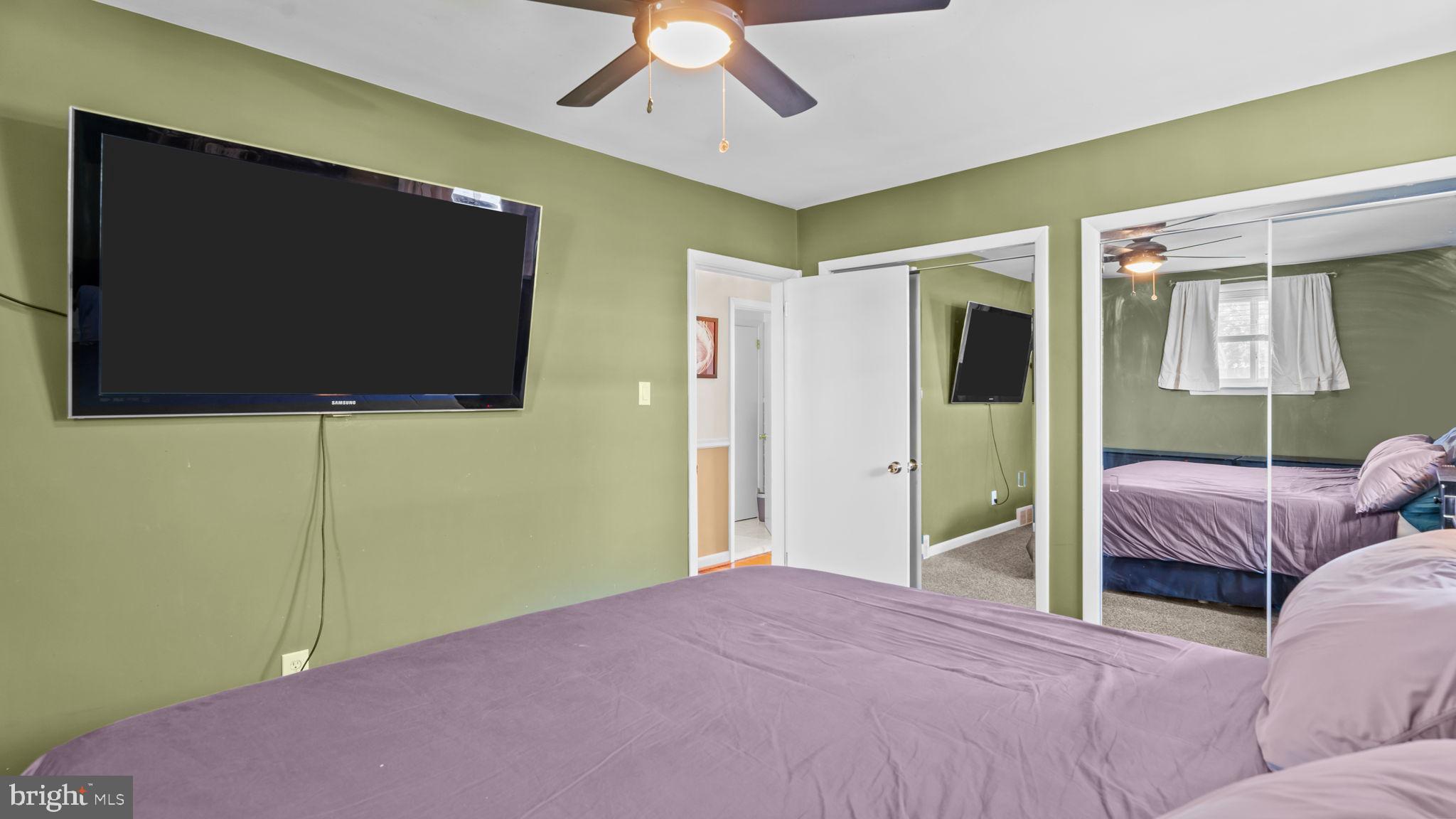 526 Palmer Road Conshohocken, PA 19428 - Photo 17 of 31 a bedroom with a bed and a flat screen tv