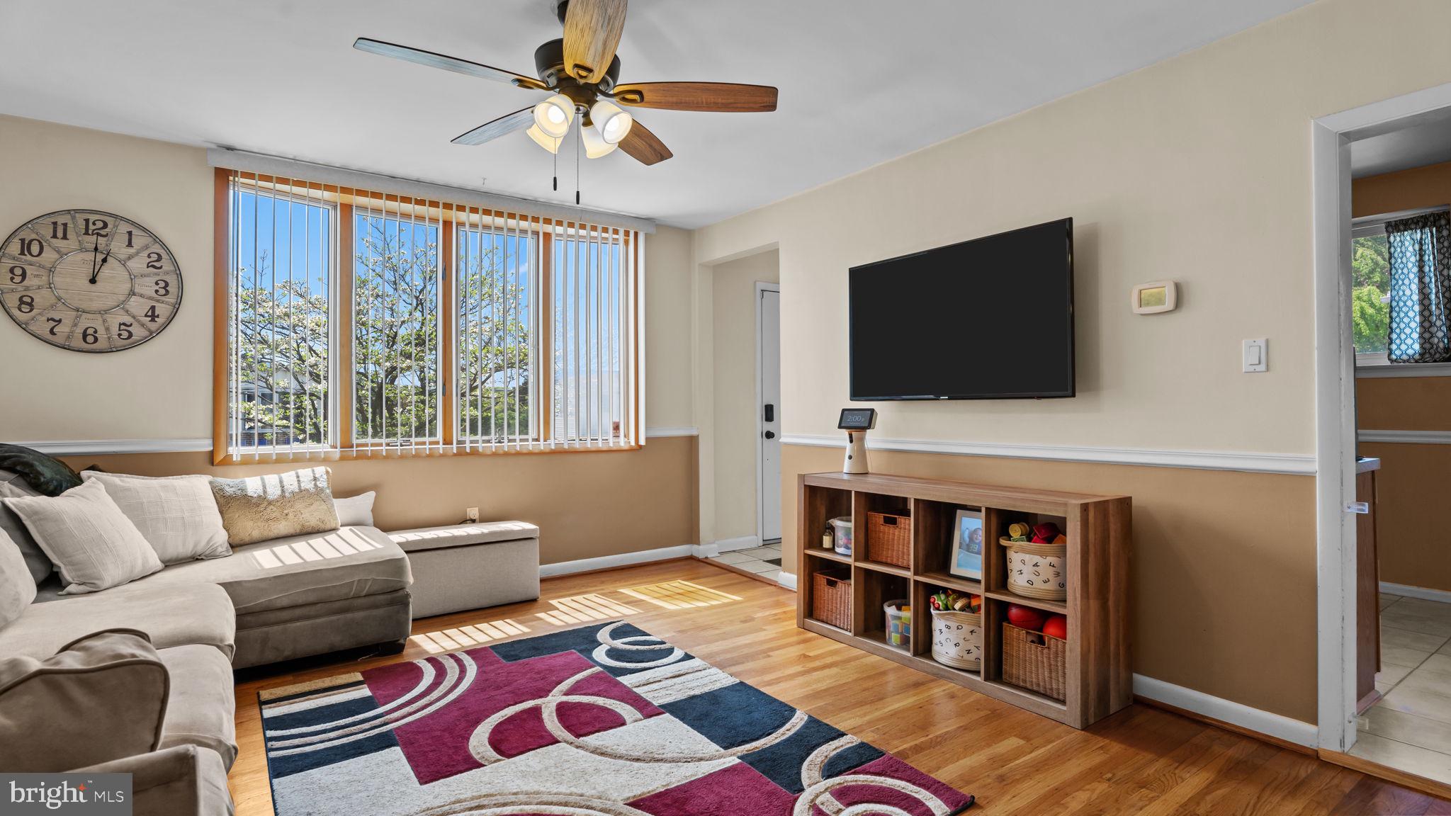 526 Palmer Road Conshohocken, PA 19428 - Photo 5 of 31 a living room with furniture and a flat screen tv