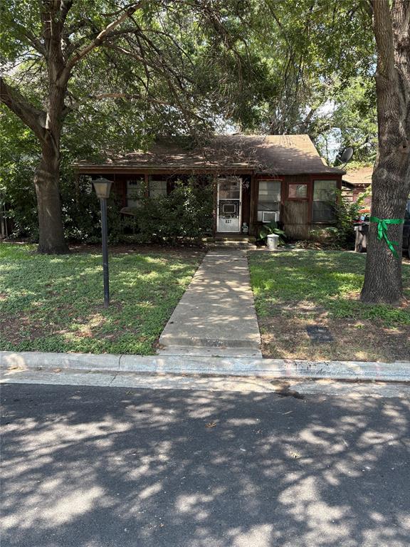 837 Edgefield Road Fort Worth, TX 76107 - Photo 1 of 1 View of front of home with a front yard and a shingled roof