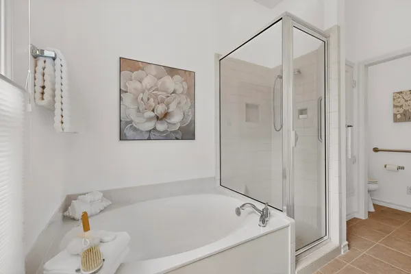 a bathroom with a tub and shower