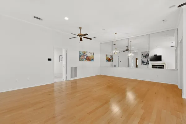 a view of a livingroom with furniture and a kitchen