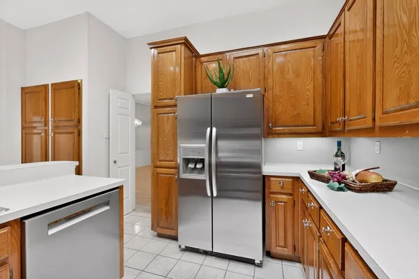 a kitchen with a refrigerator and a sink